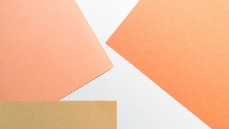 Colorful pastel paper stacks background. Abstract white beige copper brown colors. Minimalism...