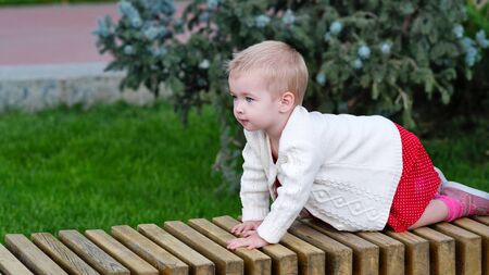 Awesome portrait toddler. Funny face. Smiling child. Happy child. Beautiful smile. Concept of growth, development of movement up and forwardの写真素材