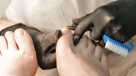 Master chiropody removes the cuticle. Spa. Concept body care.の写真素材