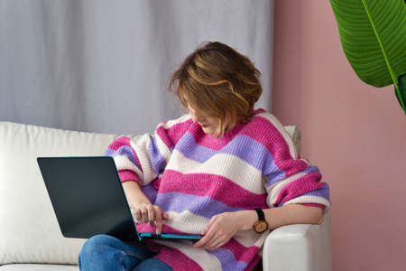 Entrepreneur Business Woman Working From Home On Laptop. Lifestyle moment. Remote Work Lifestyle Concept. Freelance Career. Self Isolationの写真素材