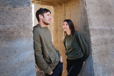 Handsome Bearded Man And Attractive Young Woman In Love. Having romantic. Lovers Posing Against the...