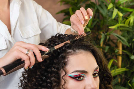 Hairdressing services. Creation of evening hairstyles fashionable stylish womens hairstyles. Hair...