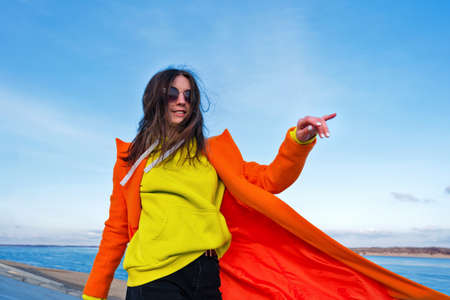 Atmospheric lifestyle photo Millennial Hipster Girl in trendy colorful casual outfit. Happy brunette...