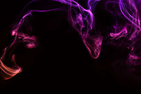 Abstract colored smoke hookah on dark background. Texture. Art Design element. Personal vaporizers fragrant steam. Concept of alternative non-nicotine smoking. E-cigarette. Evaporator.の写真素材