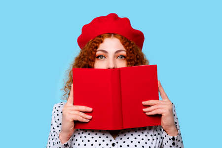 Young Curly Redhead Woman in Mortarboard Celebrating Graduation and Getting Diploma. Graduate Female...