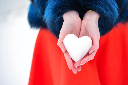 Funny Emotional Girl in Blue Fur Coat Walks in Winter Park in Good Weather. Close-up Portrait Young...