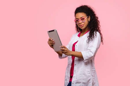 Friendly African American Female Physician Medical Advisor Shows Heart Gesture with Two Hands on...