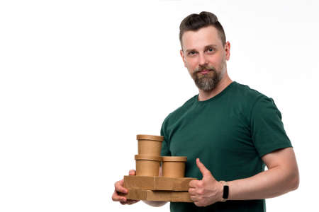 Portrait calm confident handsome bearded man in white shirt and blue t-shirt holding red book and...