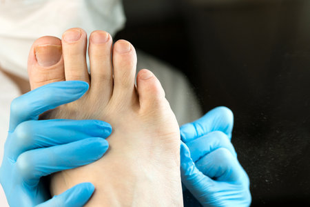 hardware pedicure procedure. Chiropodist master processes feet female client. Electric pedicure tool. foot careの写真素材