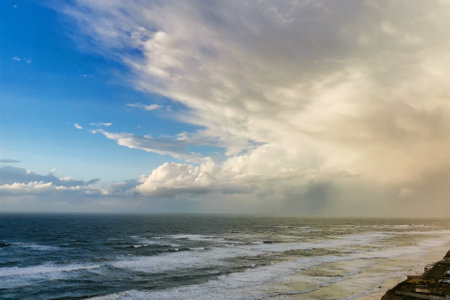 Seascape. Colorful sky with weather clearing up after winter storm. Sunny weather over Herzliya Beach. natural backgroundの写真素材