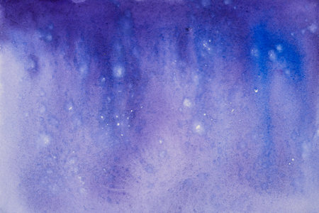 Watercolor rendition evoking a celestial nebula, with specks resembling distant starsの写真素材