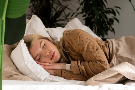 Blissful sleep amidst indoor greenery. Healthy sleep for a young, attractive woman