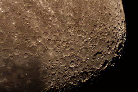 Zoomed-in view of lunar terrain displaying countless impact cratersの写真素材