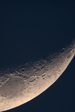 Illuminated Moon cratered terminator region captured in detail. High-Resolution Astrophotograph of...