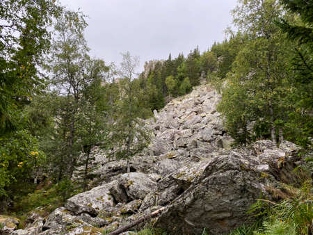 Climbing the Mitkini rocks. The popular tourist destination. Taganay national Park. Zlatoust city. Chelyabinsk region. South Ural. Russia.の写真素材