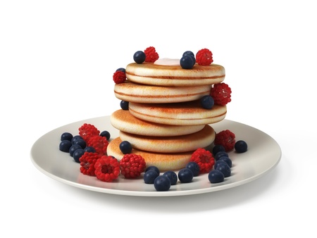 Pancake tower with mixed berries isolated on white backgroundの写真素材