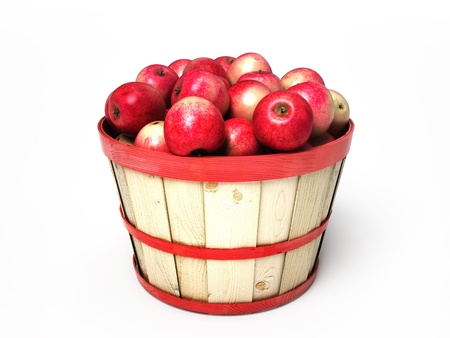 Apples sitting in a wooden basket isolated on white backgroundの写真素材