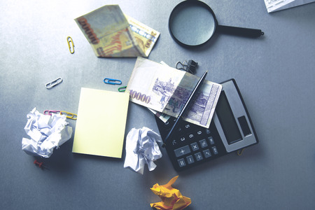 stationary and money on deskの写真素材