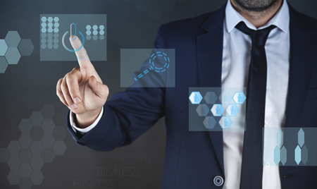 young  business man touching in virtual screenの写真素材