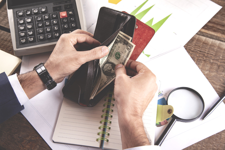 man hand money with wallet and calculator