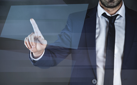 business man touching in virtual blue  screenの写真素材