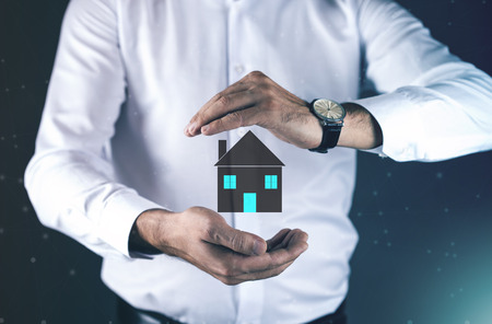 man hand house model in screenの写真素材