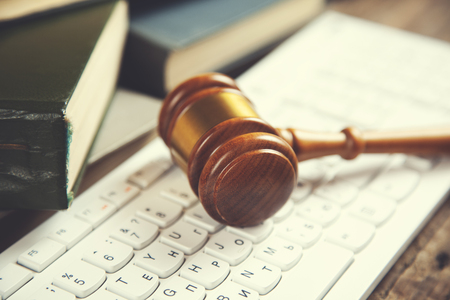 judge on computer keyboard on the table