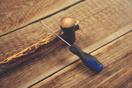 screwdrivers and hammer on the wooden vintage table