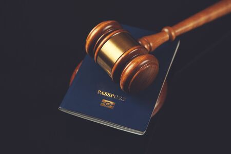 judge with passport on the table backgroundの写真素材