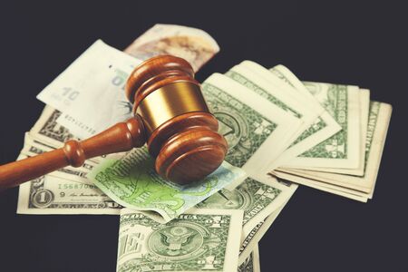 judge with money on the black tableの写真素材