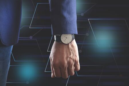 young business man hand watch in graph screen