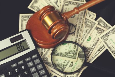 judge with money and calculator on the table