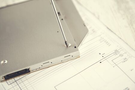 dvd drive with screwdriver on the tableの写真素材