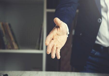 Portrait of a successful businessman giving a handの写真素材