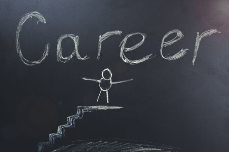 career text with people on degree on chalkboardの写真素材