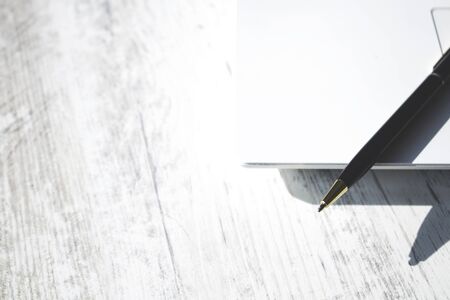 pen on computer keyboard on table backgroundの写真素材