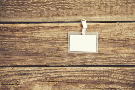 Blank Identification Card with Neckband on Wooden Backgroundの写真素材