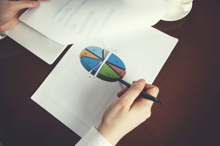 young woman hand graph  on the deskの写真素材