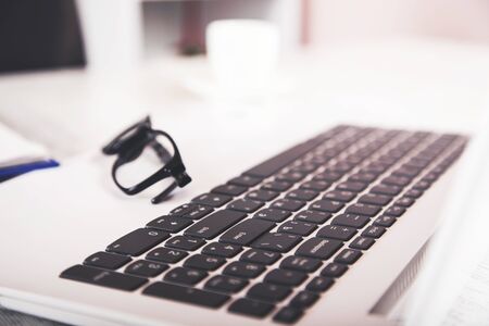 glasses on the notebook laptop  on desk