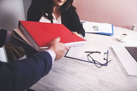 worker hand document with boss in office