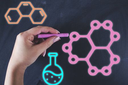 woman written laboratory workspace elements  on chalkboardの写真素材