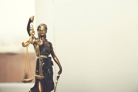 beautiful justice lady on white wall background