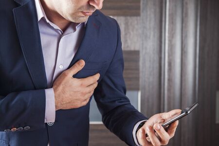 sad  man hand phone with in heart