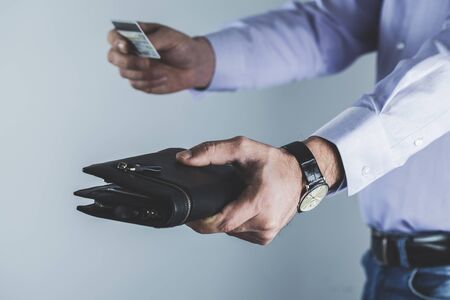 man hand holding wallet with credit card