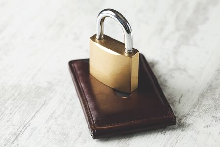 lock on brown wallet on the deskの写真素材