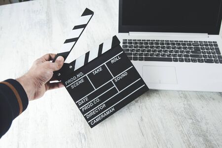 man hand movie sign on computer keyboardの写真素材