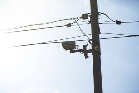 white speed camera in the street under sky