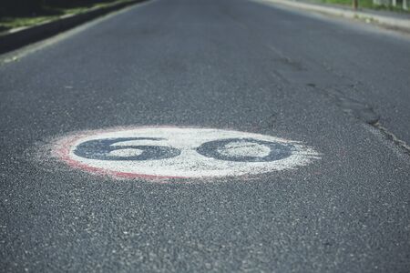 60 text in asphalt  road in the streetの写真素材