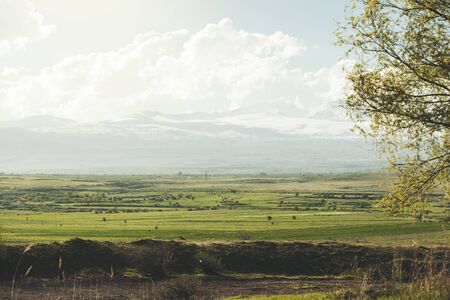 beautiful green landscape with mountain under skyの写真素材