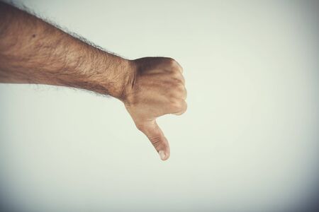 young man hand no sign on gray background